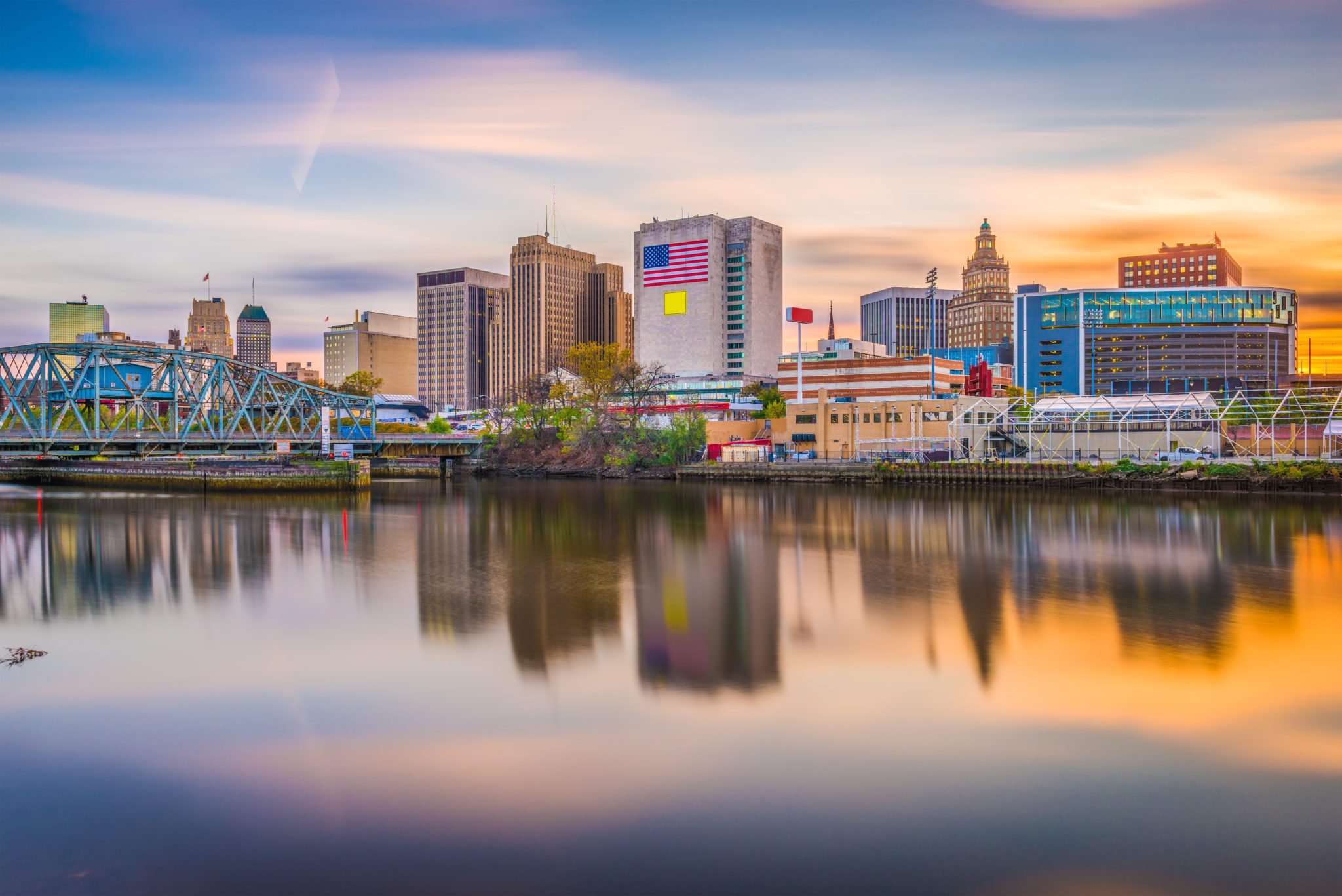 Tall Buildings with a beautiful river and a bridge